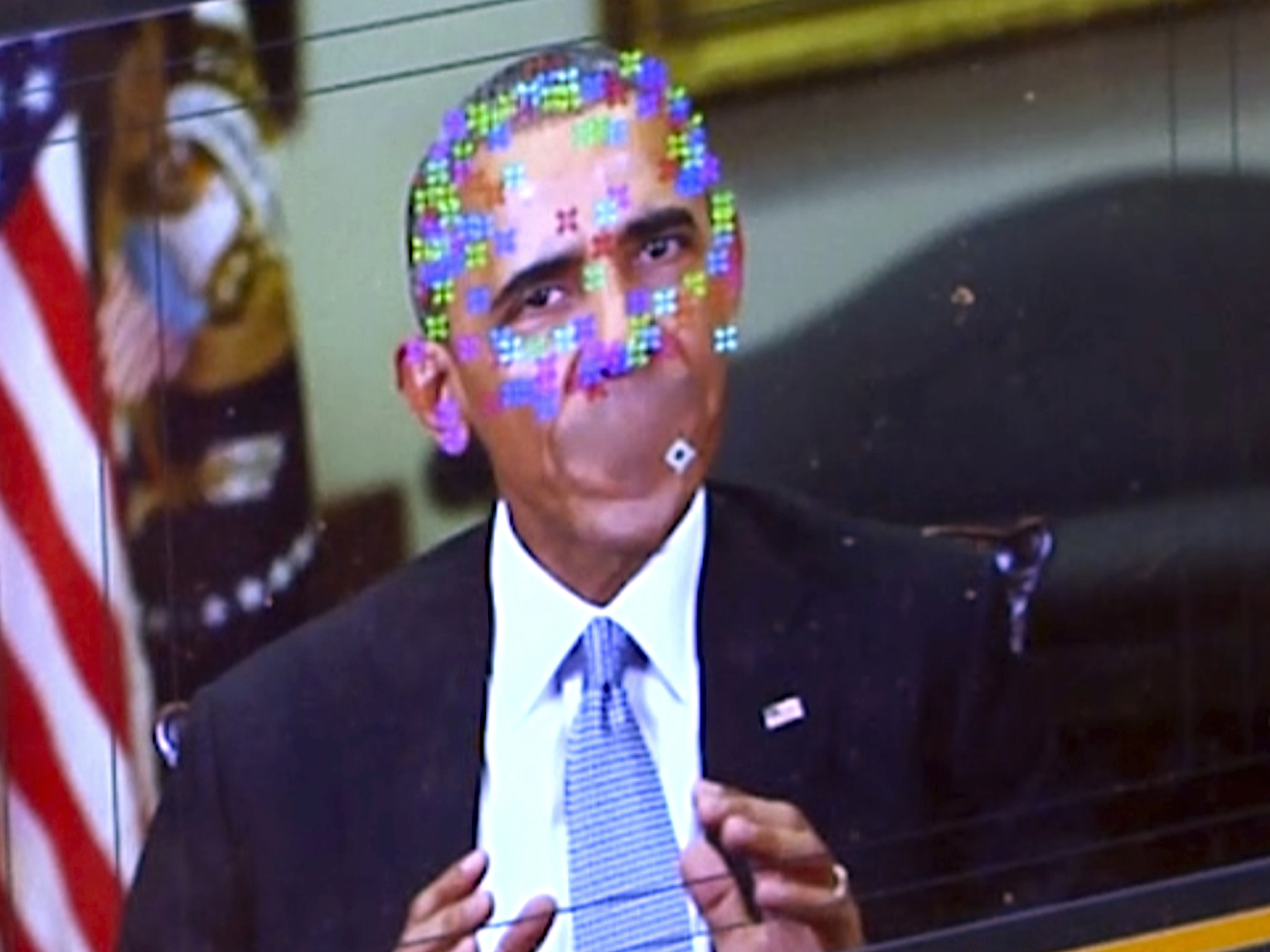 caption: A fake video featuring former President Obama shows elements of facial mapping used in new "deepfake" technology that lets anyone make videos of real people appearing to say things they've never said. (AP Photo)