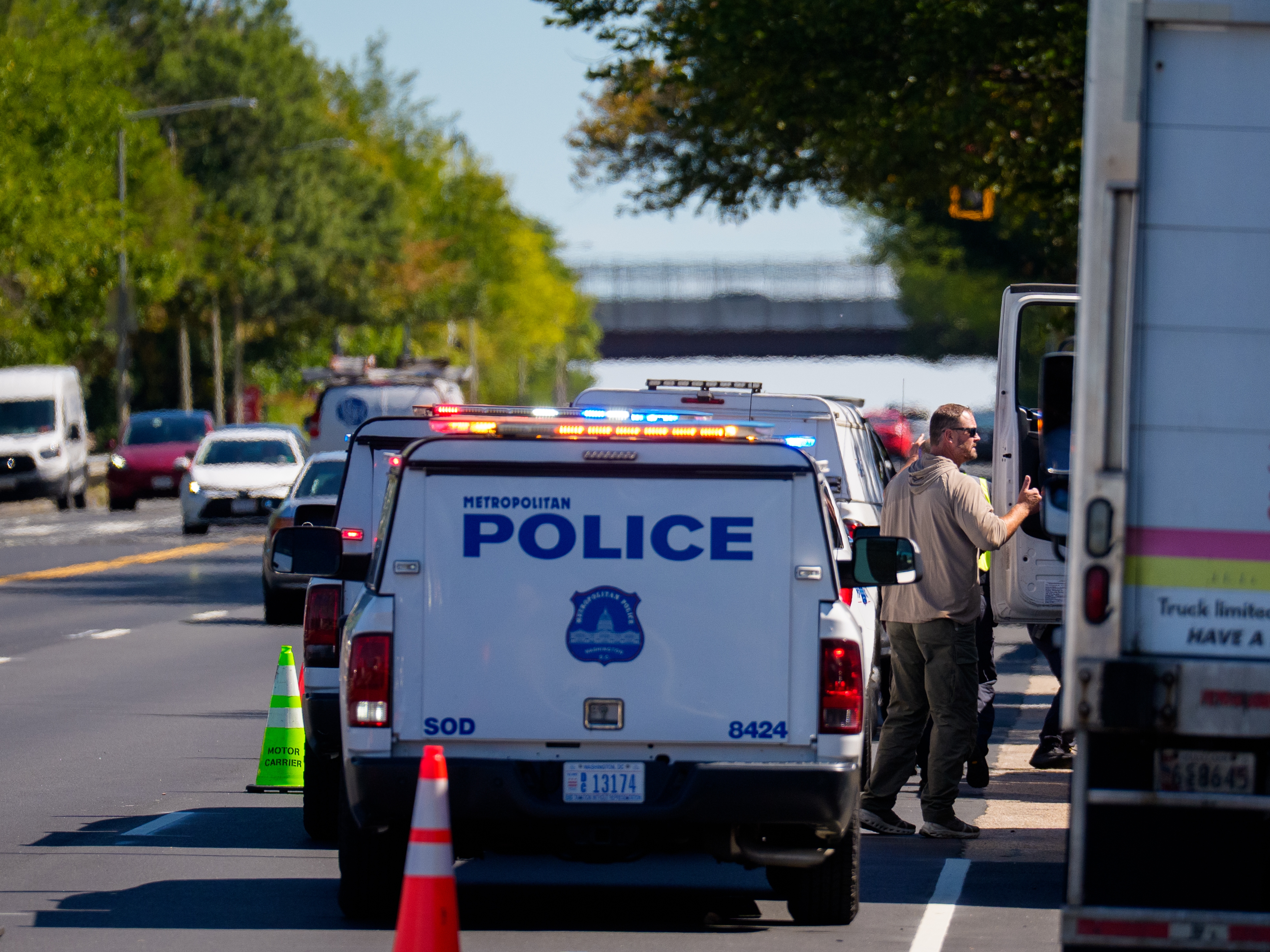 caption: Law enforcement officers with the Department of Homeland Security and the Metropolitan Police Department set up a traffic safety checkpoint along a busy Washington, D.C., street on Monday.