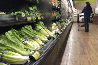 caption: Romaine lettuce still sits on the shelves as a shopper walks through the produce area of an Albertsons market Tuesday, Nov. 20, 2018, in Simi Valley, Calif. (Mark J. Terrill/AP)