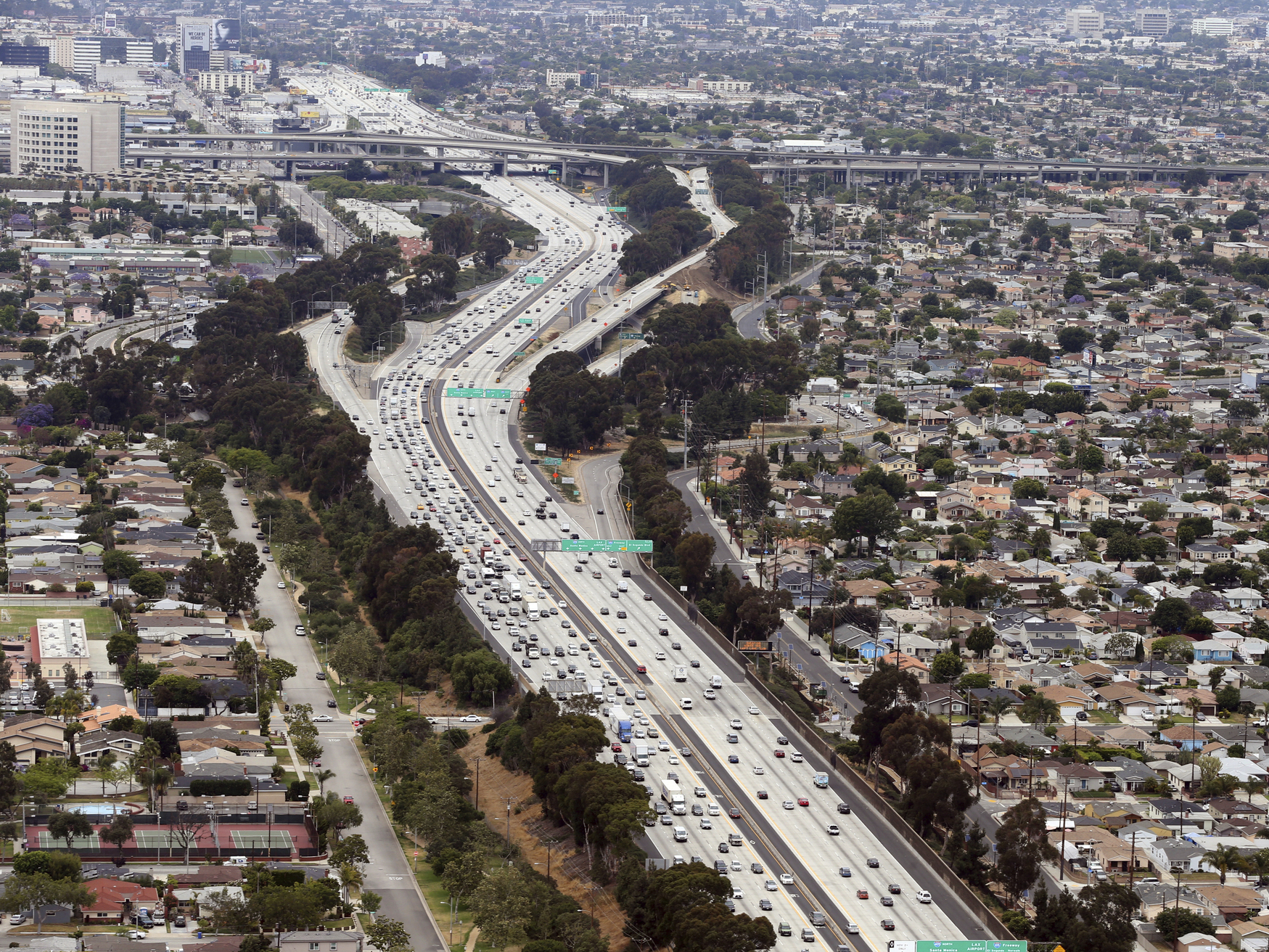 caption: Interstate 405 cuts through neighborhoods near the Los Angeles International Airport, seen here in 2017. A new study found links between modern urban air pollution and historical redlining at the national level.