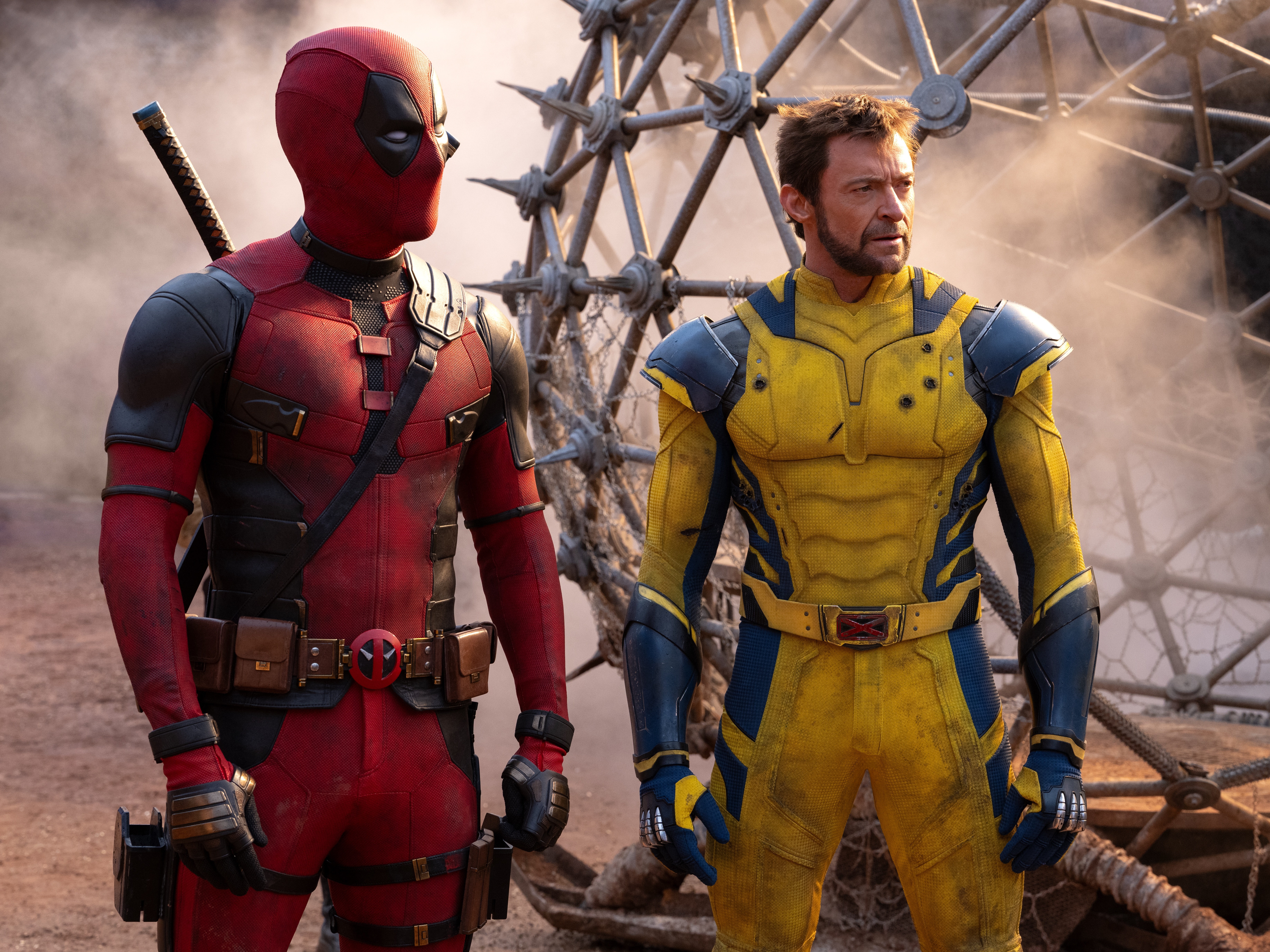 caption: Ryan Reynolds stars as Deadpool and Hugh Jackman as Wolverine in an odd-couple action hero pairing.