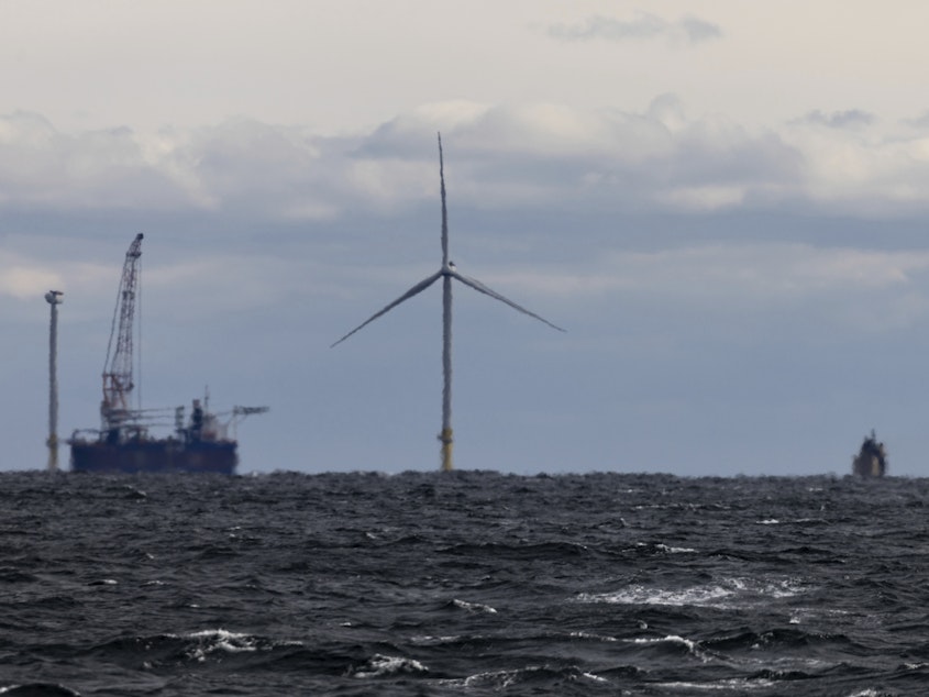 caption: The first operating South Fork Wind farm turbine stands east of Montauk Point, N.Y., on Dec. 7, 2023. South Fork Wind, America's first commercial-scale offshore wind farm, is officially open.