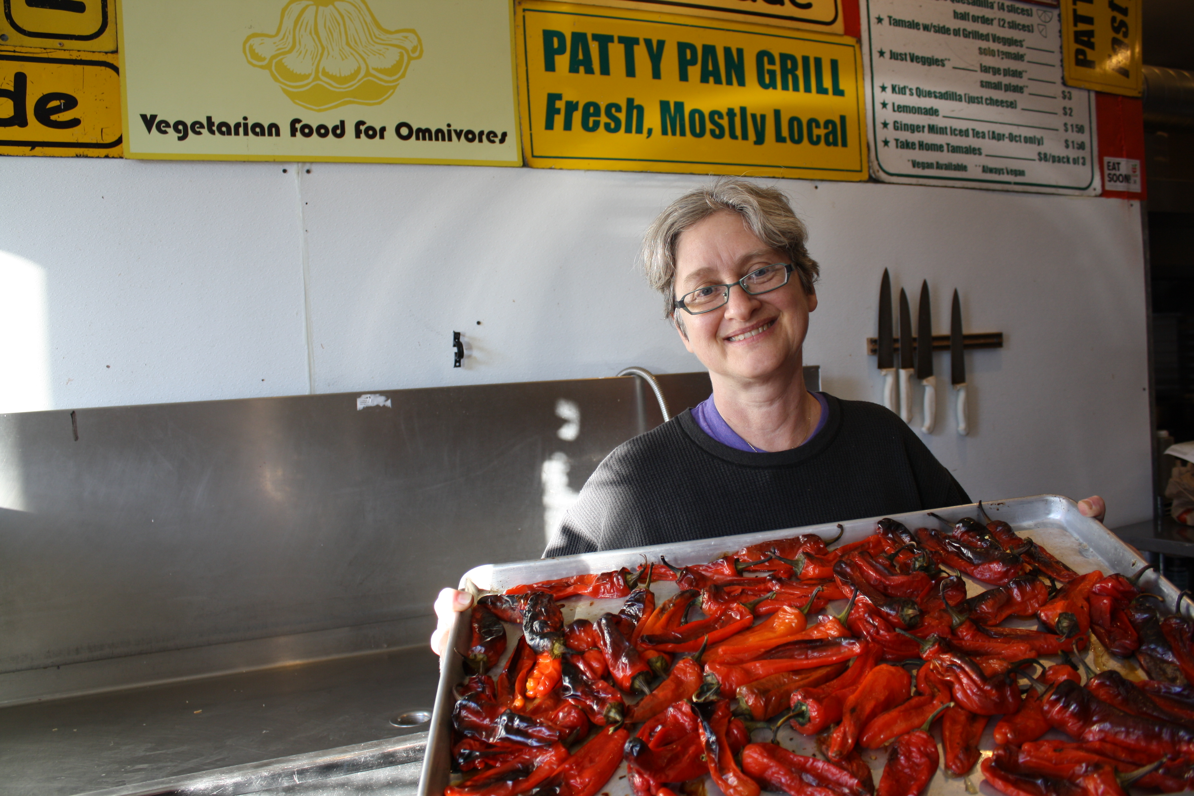 caption: Devra Gartenstein's Patty Pan Grill (a cooperative owned by its employees) serves food almost exclusively at farmers markets. These roasted "Jimmy Nordello" peppers from Steel Wheel Farm near Mt. Si will eventually adorn tamales as a sauce. 