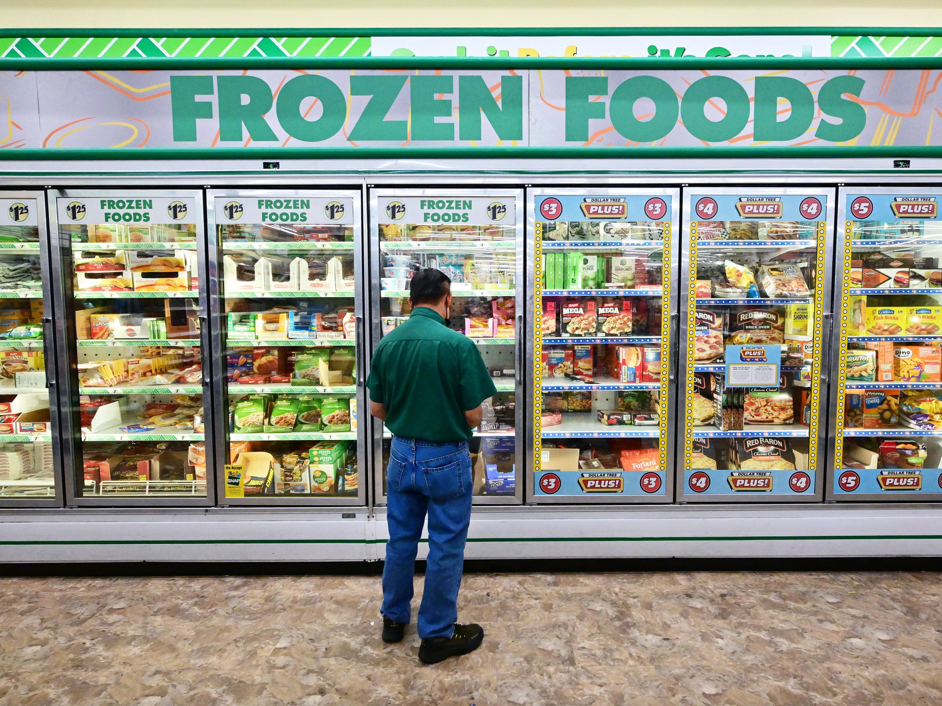 caption: A man ponders the options at a Dollar Store in Alhambra, California. Shoppers continue to face high prices on everyday goods. Inflation is the top voter concern in the midterm elections.