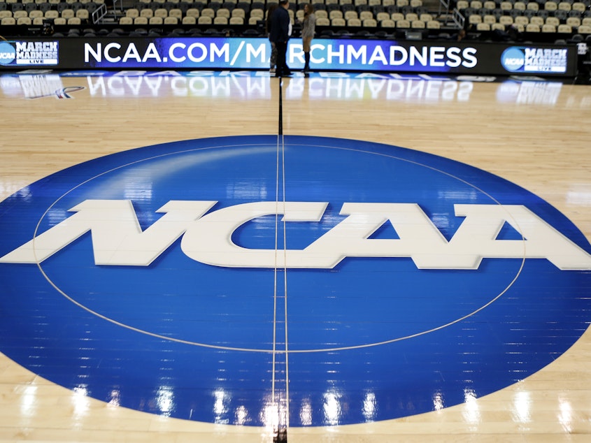 caption: In this March 18, 2015, file photo, an NCAA logo is displayed at center court as work continues at The Consol Energy Center in Pittsburgh, for the NCAA college basketball second and third round games.
