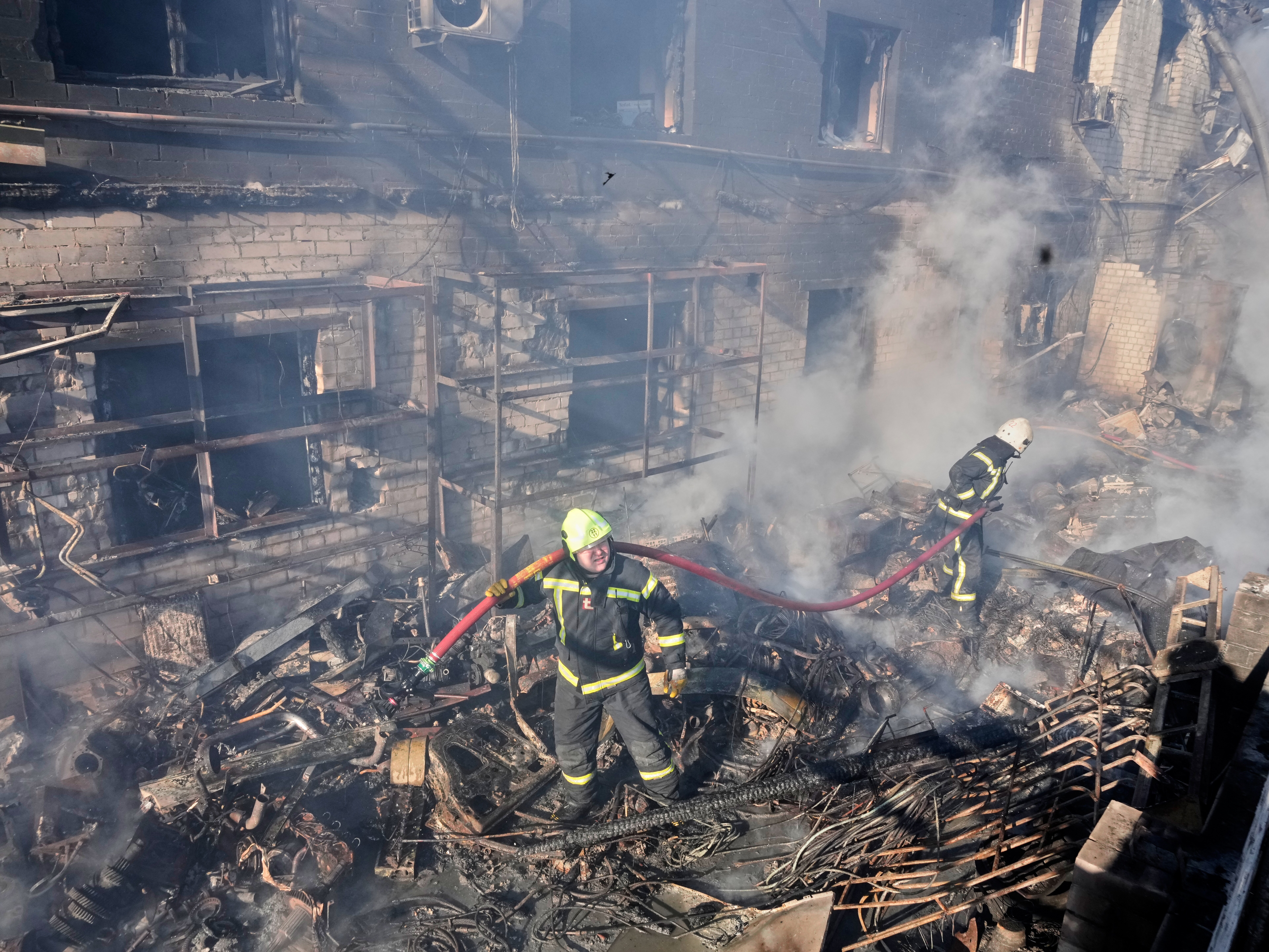 caption: Firefighters put out the fire at a residential neighbourhood following a Russia missile and drone attack, in Brovary, close to Kyiv, Ukraine, on Saturday.