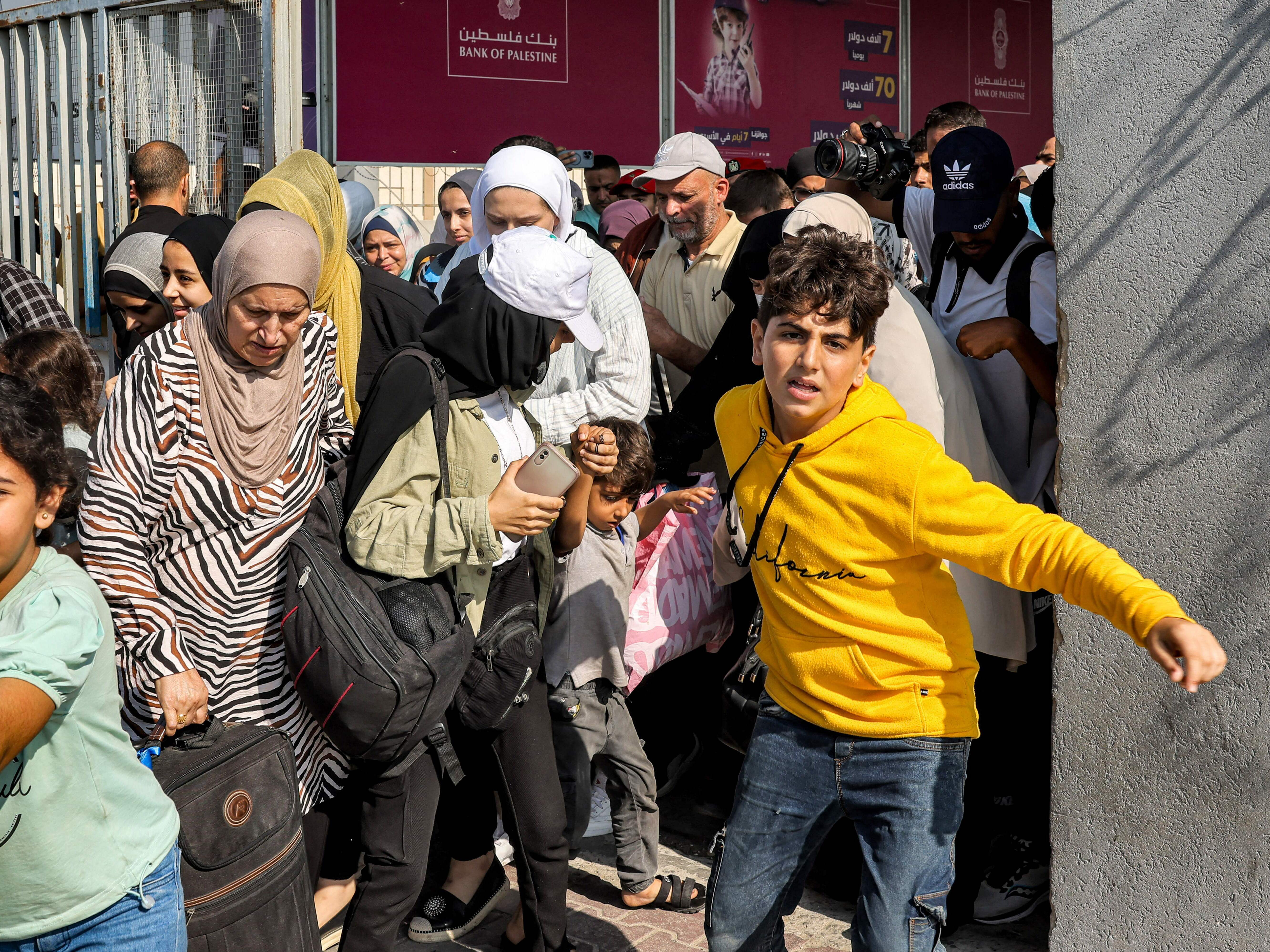 caption: Scores of foreign passport holders trapped in Gaza started leaving the war-torn Palestinian territory on Nov. 1 when the Rafah crossing to Egypt was opened up for the first time since the Oct. 7 Hamas attacks on Israel.