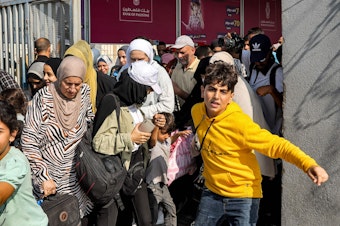 caption: Scores of foreign passport holders trapped in Gaza started leaving the war-torn Palestinian territory on Nov. 1 when the Rafah crossing to Egypt was opened up for the first time since the Oct. 7 Hamas attacks on Israel.