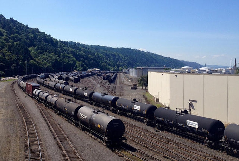 caption: Tank cars, many of them placarded as holding crude oil and other hazardous materials, sit in a BNSF yard in Northwest Portland.