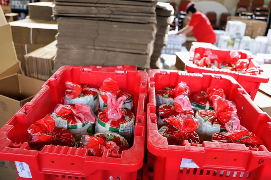 caption: Bags of tortillas will go into Mexican boxes at Alimentado el Pueblo, a food pantry serving the Latinx community in South King County.