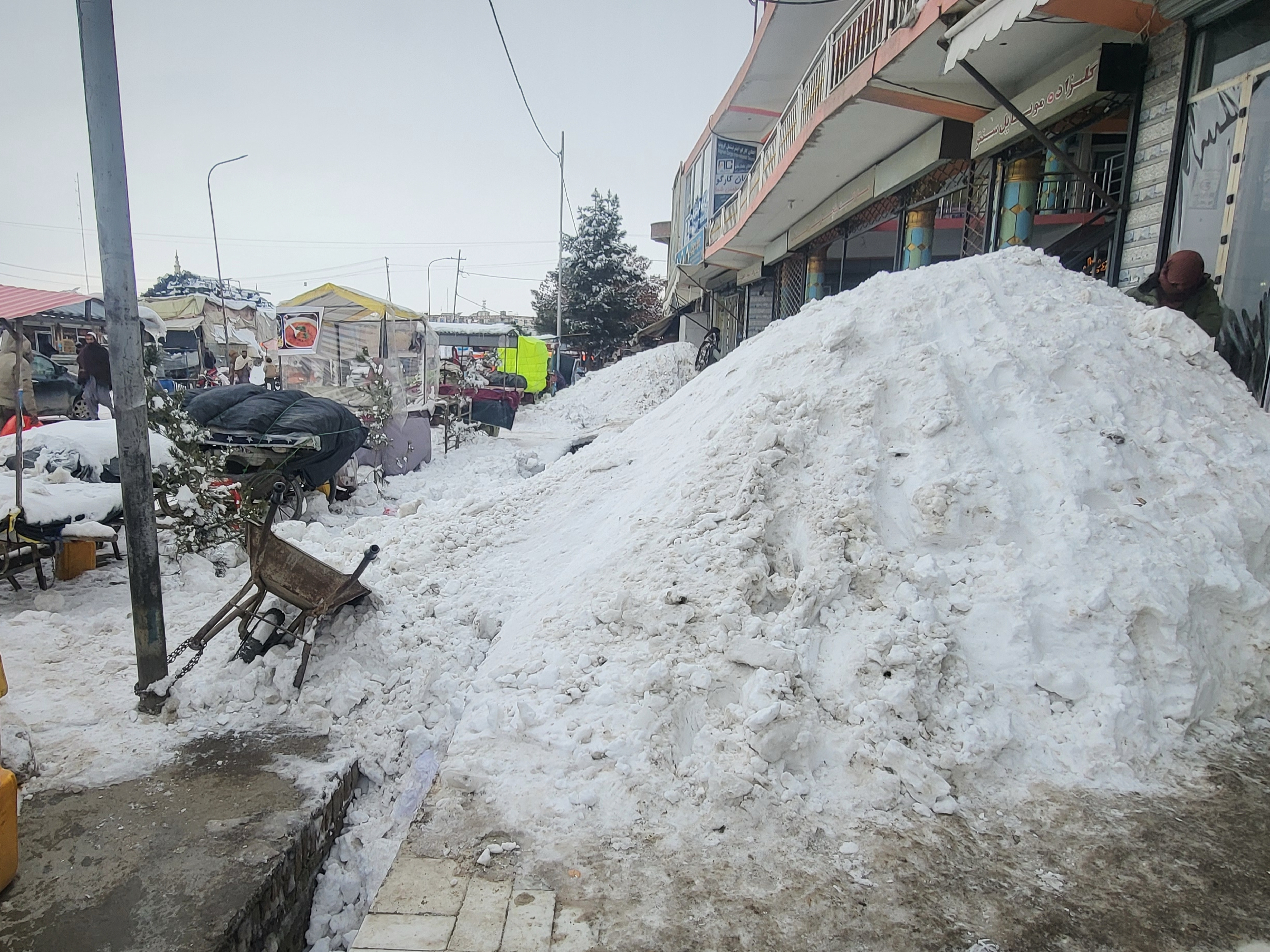 caption: Snow covers the streets of the town of Ghazni , southwest from Kabul, Sunday, Jan. 24, 2025. Heavy snow and rainfall over the past three days have killed and injured scores of people across Afghanistan, the country's disaster management authority said Saturday.