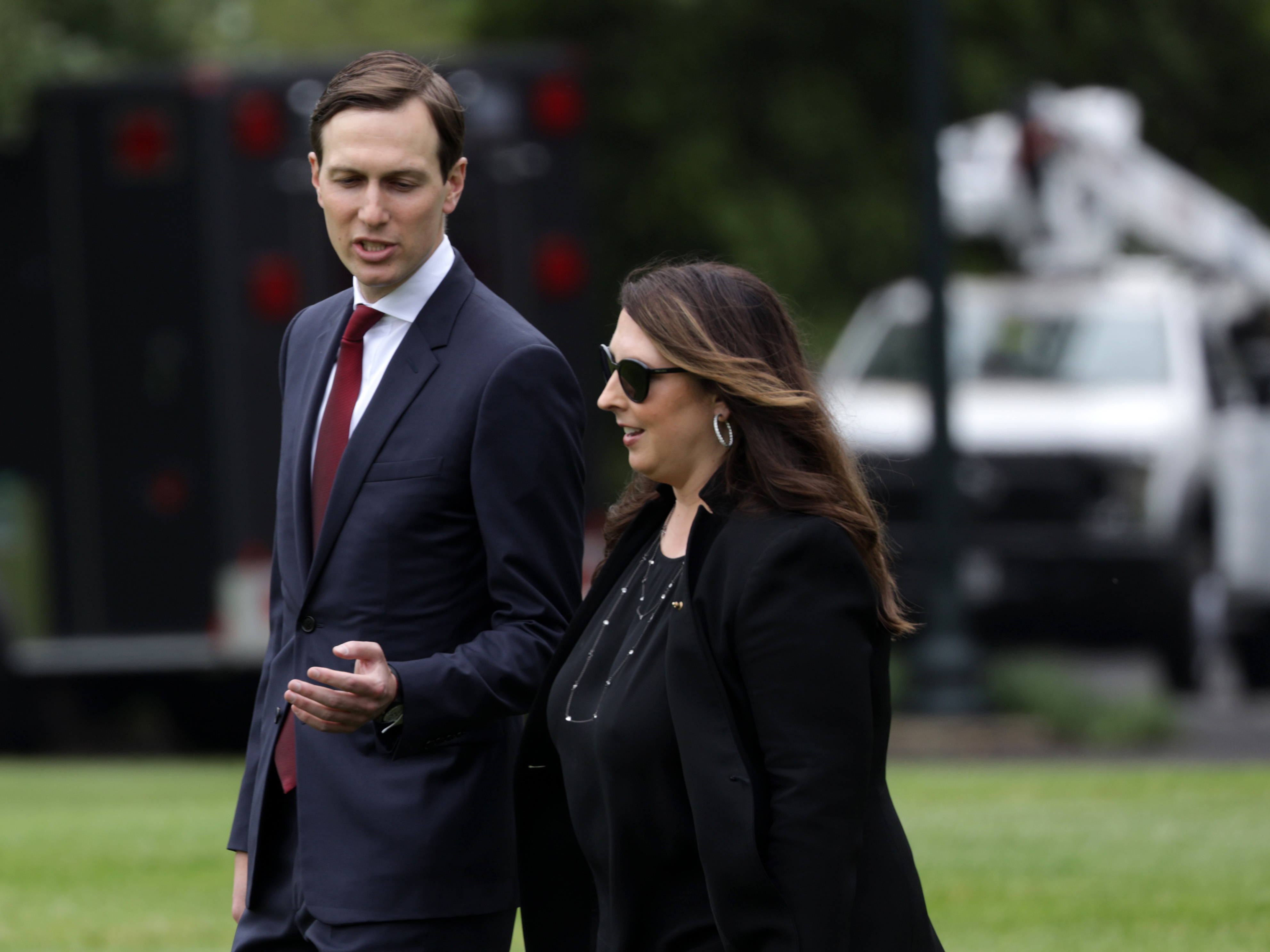 caption: Republican National Committee Chair Ronna McDaniel, right, walks with White House senior adviser Jared Kushner on the South Lawn of the White House in May. McDaniel announced Thursday that the RNC would scale back its convention plans in Jacksonville, Fla. due to the coronavirus pandemic.