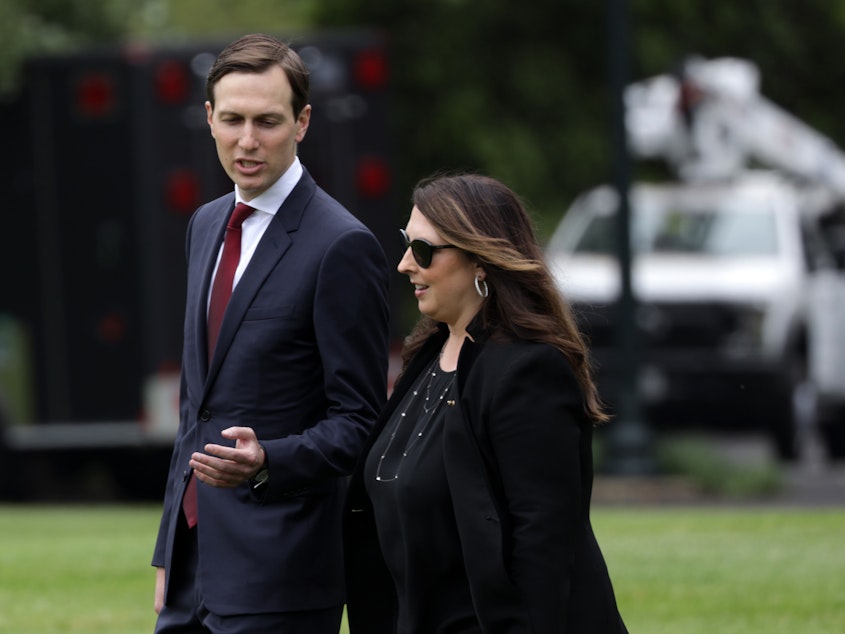 caption: Republican National Committee Chair Ronna McDaniel, right, walks with White House senior adviser Jared Kushner on the South Lawn of the White House in May. McDaniel announced Thursday that the RNC would scale back its convention plans in Jacksonville, Fla. due to the coronavirus pandemic.
