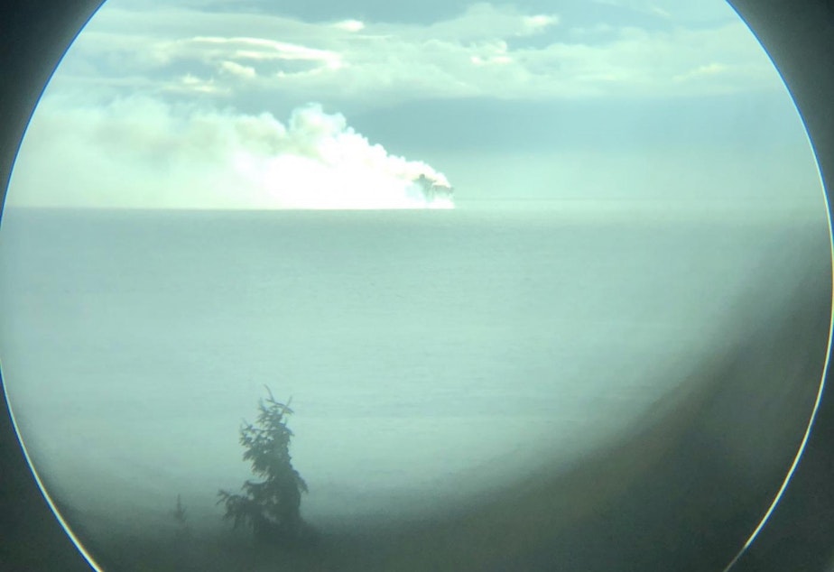 caption: The Zim Kingston engulfed in smoke Saturday afternoon off Victoria, British Columbia