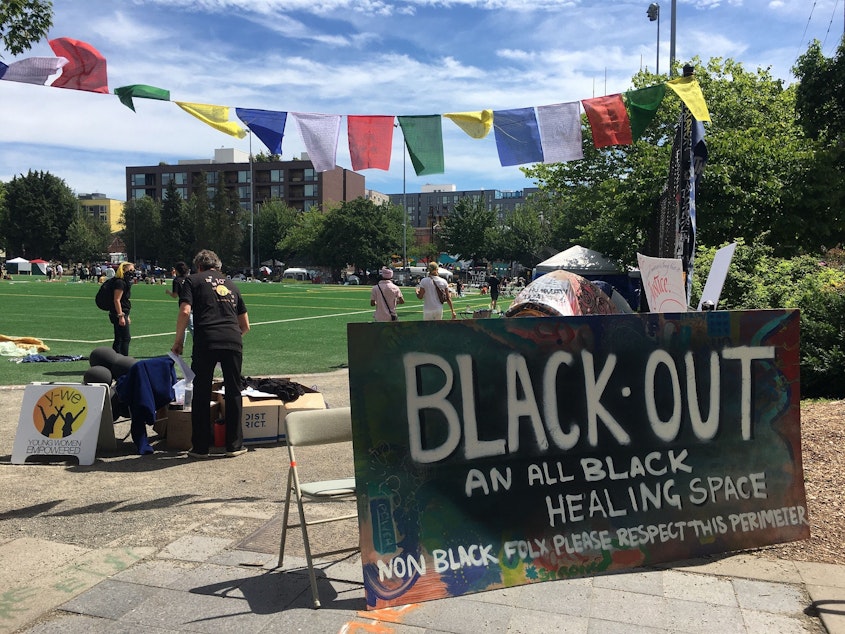 caption: A corner of CHOP was preserved for Black people only -- an "all black healing space." The sign asked that "non-Black fol please respect this perimeter," on Friday, June 19, 2020. June 19 is Juneteenth, the day that enslaved people in Texas learned they had been emancipated -- two years after the Emancipation Proclamation.