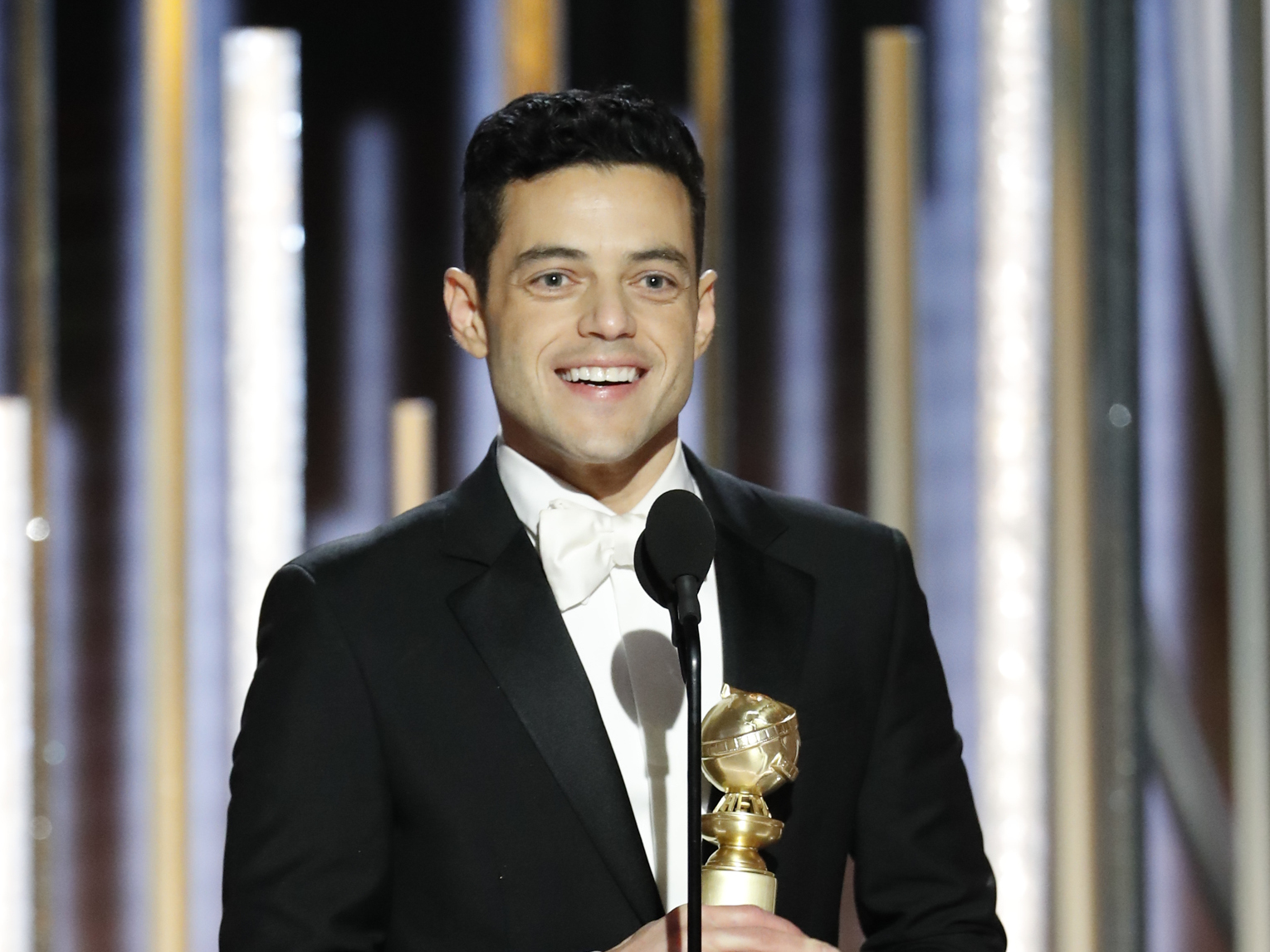 caption: Rami Malek won a Golden Globe for his performance in the drama <em>Bohemian Rhapsody</em>, in which he played iconic singer Freddie Mercury.