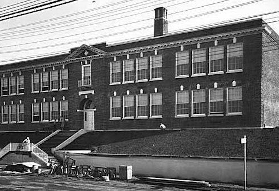 caption: Magnolia Elementary School has been boarded-up for more than a decade, and would reopen if voters approve Seattle Schools' Feb. 9 capital levy.