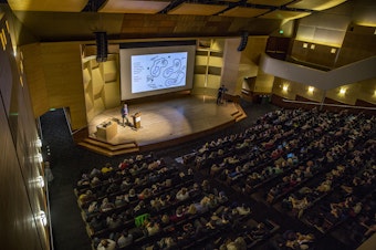 caption: A faculty lecture at University of Washington, one of many in state colleges the savings plans aims to help kids attend.