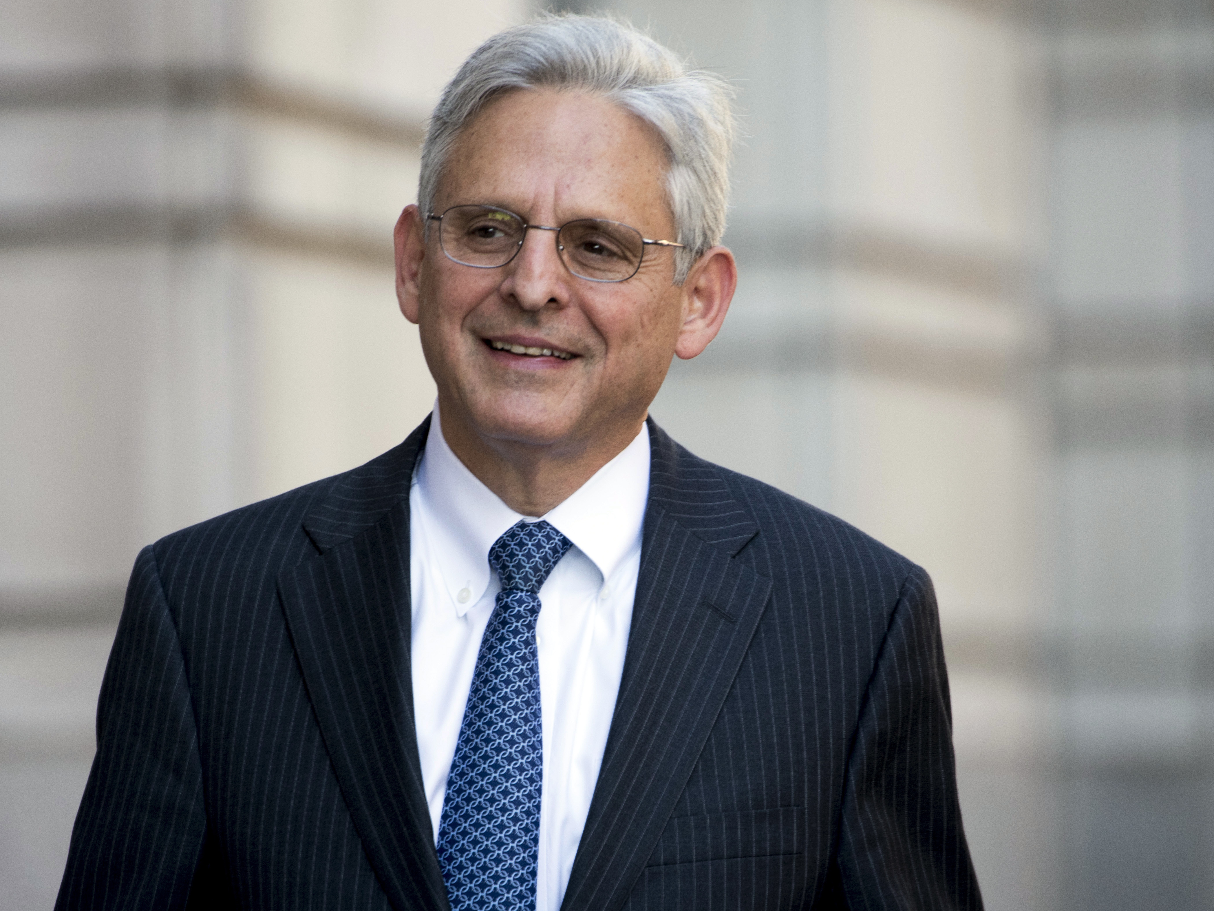 caption: U.S. appellate Judge Merrick Garland walks into federal court in November 2017 in Washington. He could be in contention for a nomination to become attorney general.