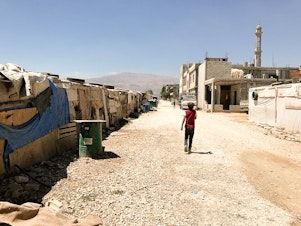 caption: An informal tented settlement for Syrian refugees in Lebanon's Bekaa Valley. AHA members filmed at this camp, gathering footage for their fundraising video