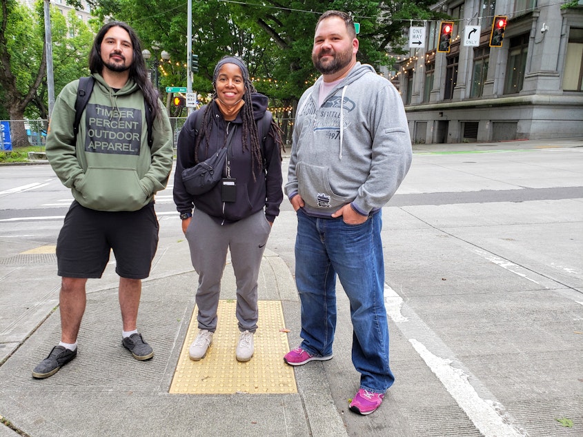caption: From left: Kirk Rodriguez, Shelby George, and Rob Alonio of the City Hall Park Neighborhood Outreach Team on Wednesday, June 15, 2022.