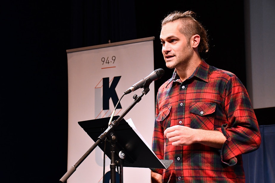 caption: Garth Donald performs his story, "A Cabin Recalled" at KUOW's Stories from THE WILD event on Friday, October 11, 2019, at McCaw Hall in Seattle.
