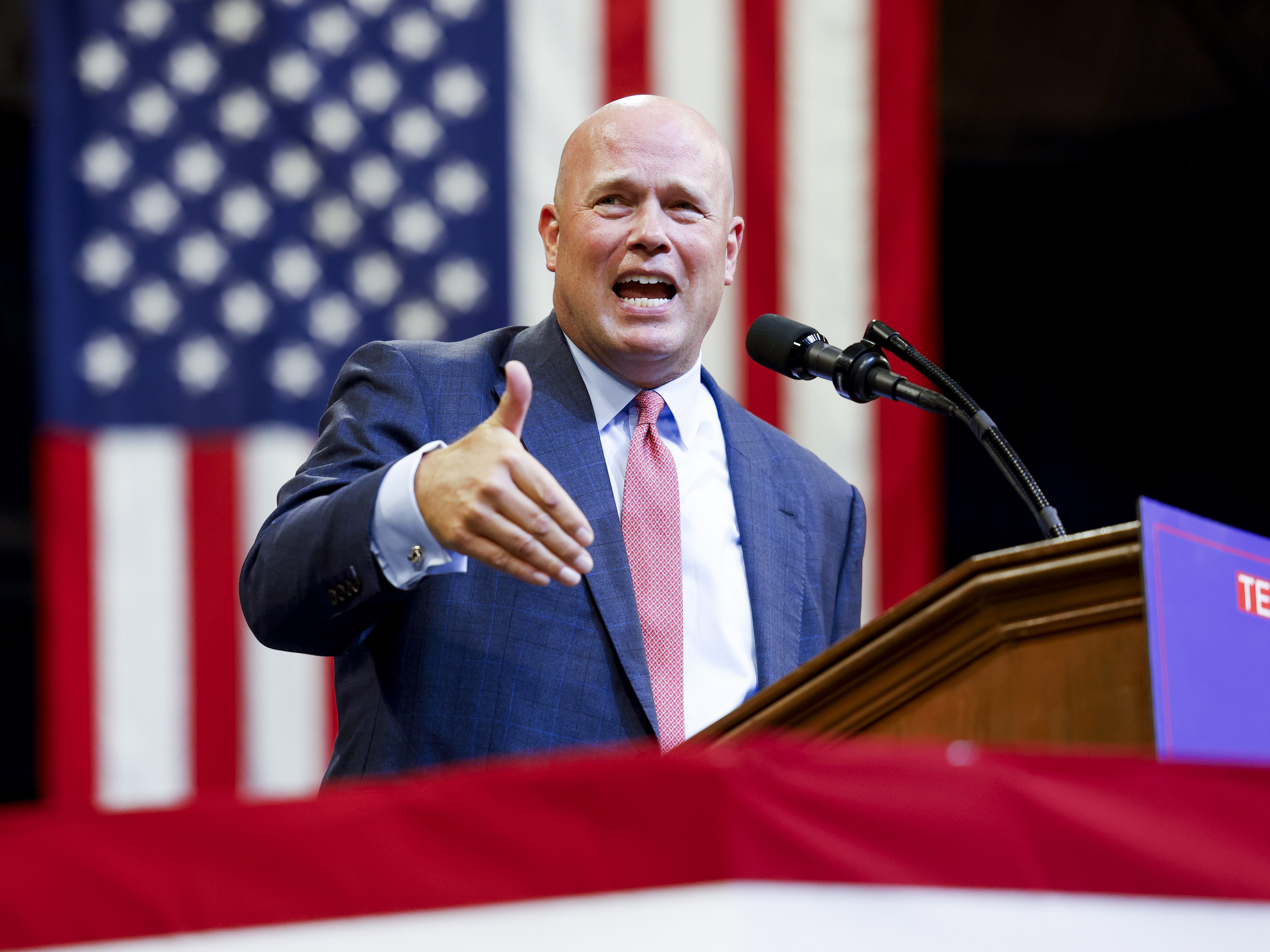 caption: Matthew Whitaker, Trump's pick as ambassador to NATO, speaks during a Trump rally at Montana State University on Aug. 9, in Bozeman, Mt.