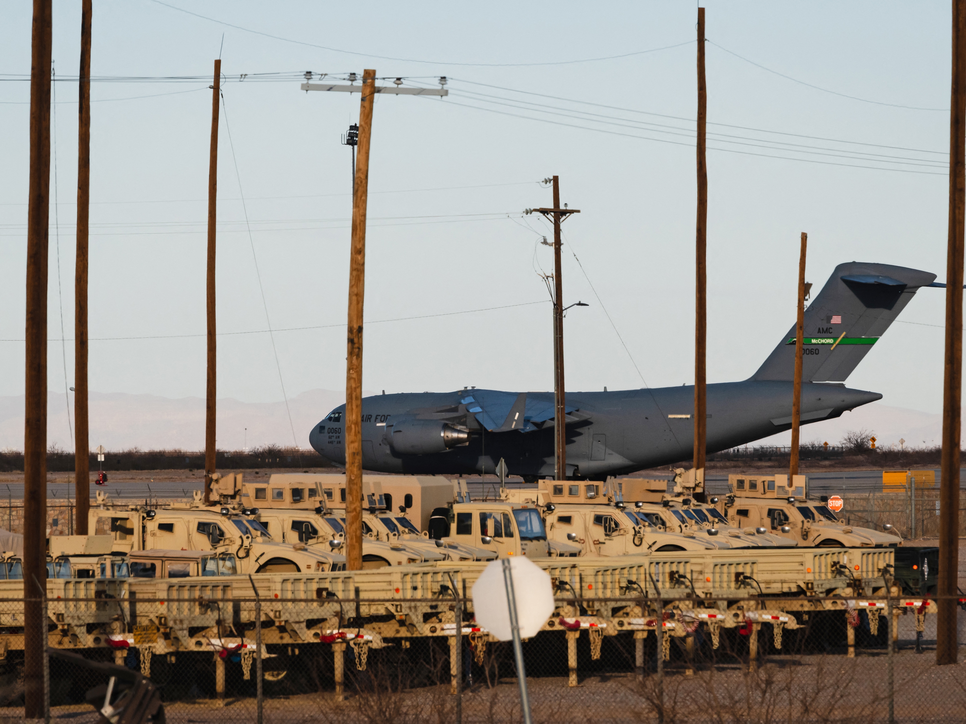 caption: A United States Air Force Boeing C-17 used for deportation flights is pictured at Biggs Army Airfield in Fort Bliss, El Paso, Texas on February 13, 2025.