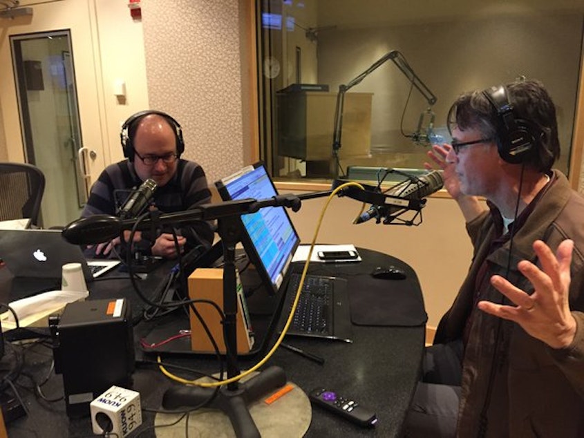 caption: Todd Bishop and KUOW's Bill Radke geek out in the KUOW studios. 