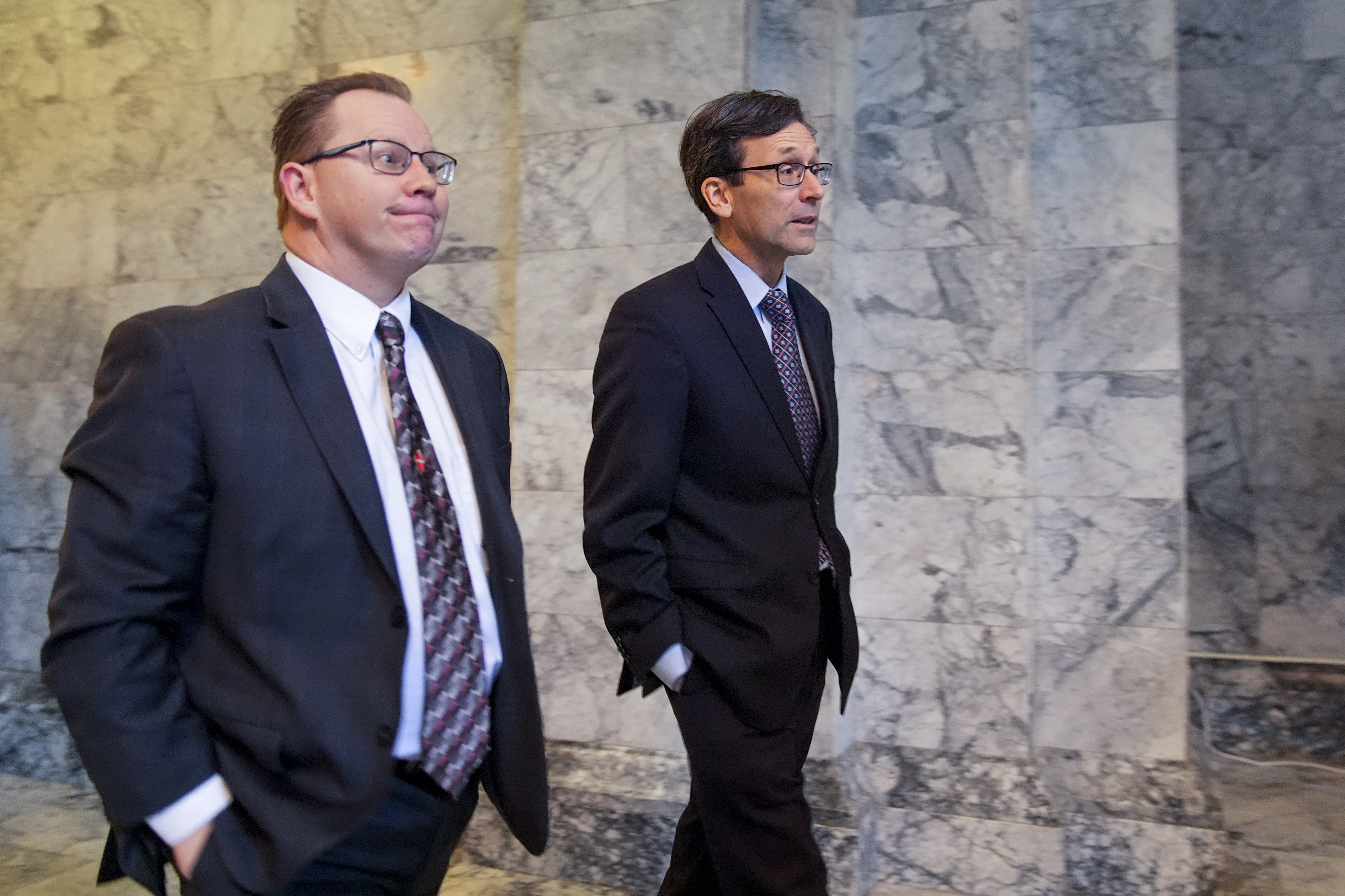 caption: Superintendent of Public Instruction Chris Reykdal, left, walks with former Attorney General (now Governor) Bob Ferguson, right, before the State of the State address from former Gov. Jay Inslee during a joint legislative session at the Washington state Capitol, Tuesday, Jan. 9, 2024, in Olympia. 
