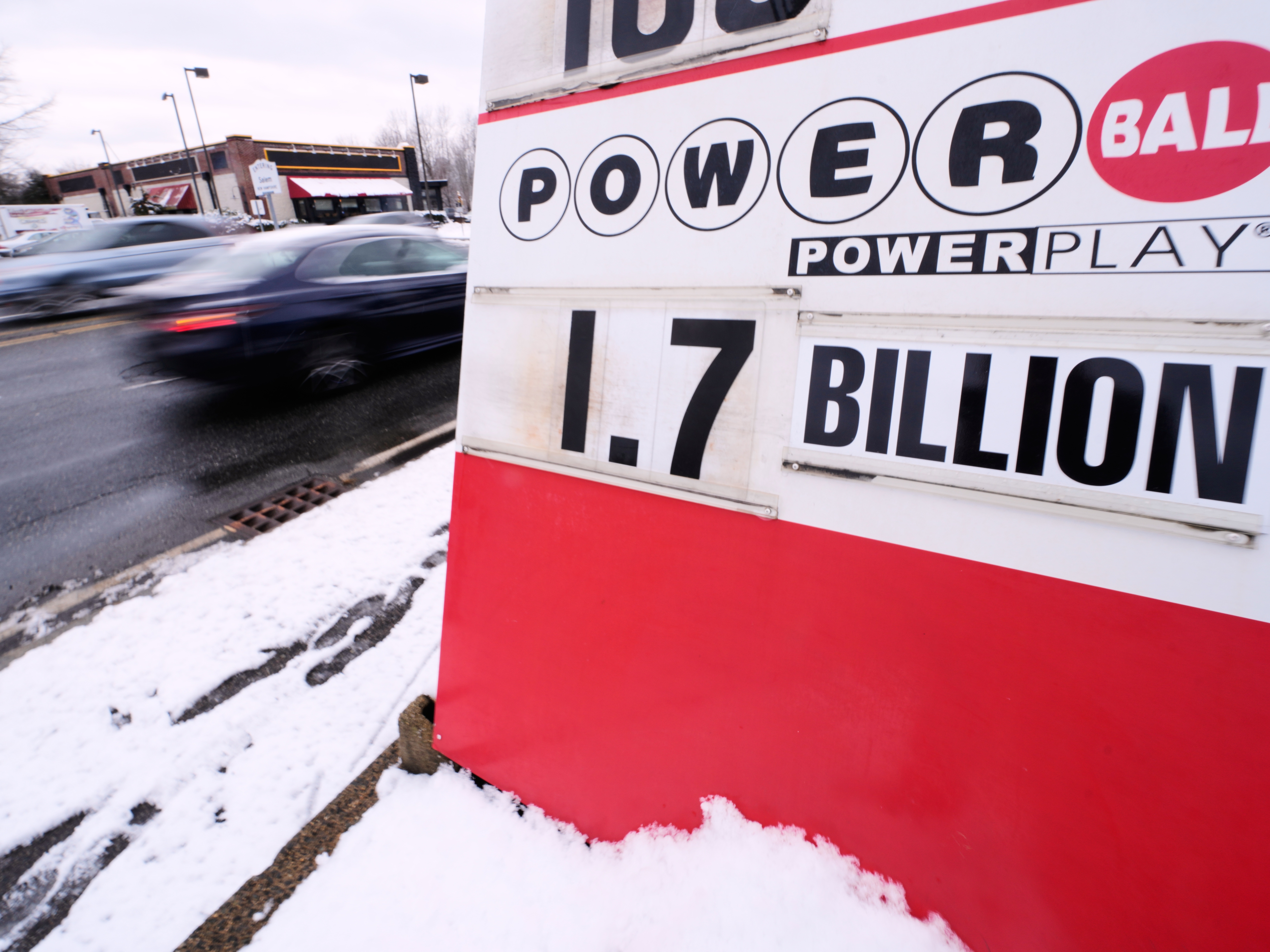 caption: The jackpot for the Powerball lottery game is displayed outside Ted's State Line Mobil station, Wednesday, Dec. 24, 2025, in Methuen, Mass.