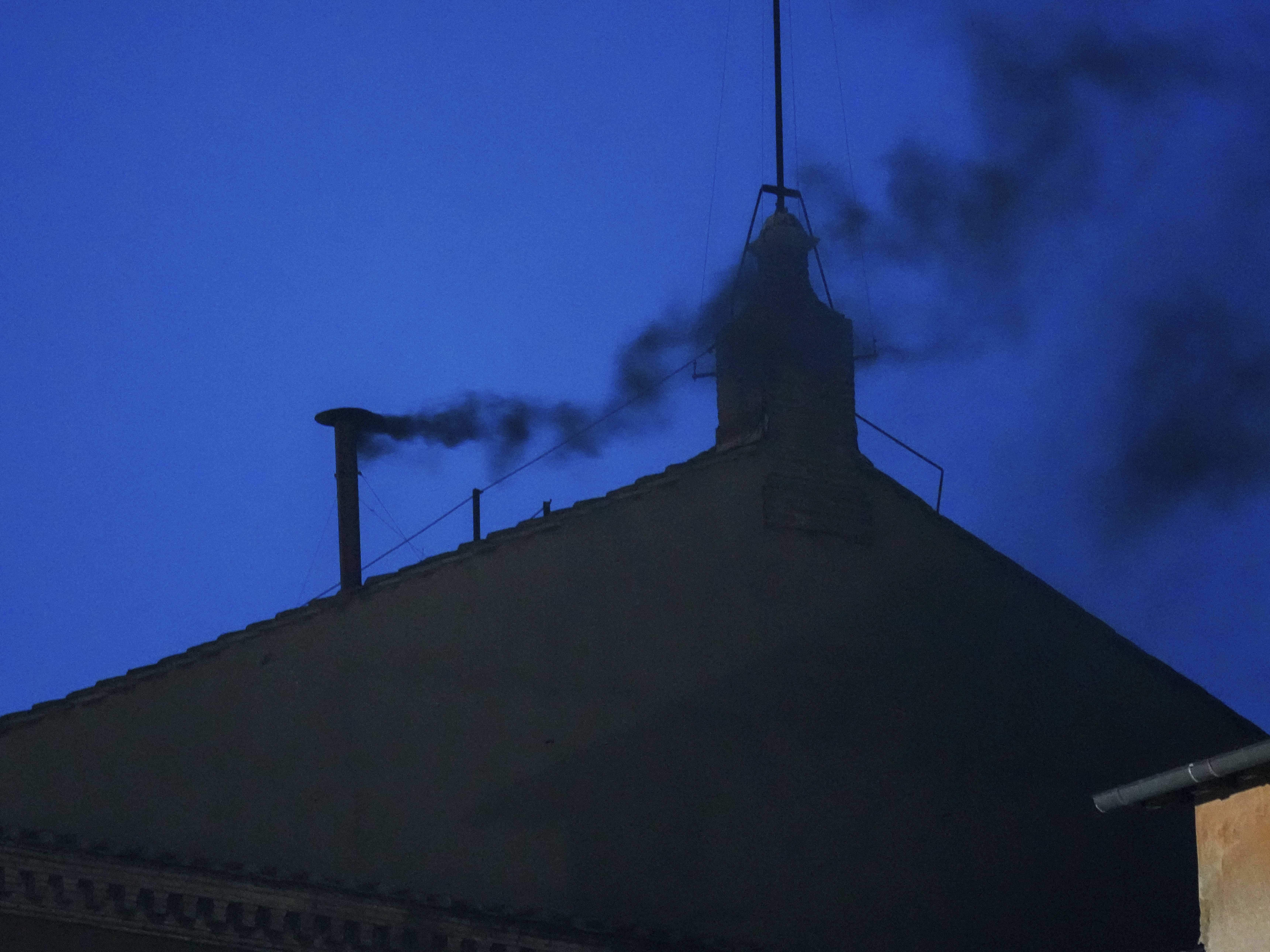 caption: Black smoke billows from the chimney of the Sistine Chapel, where 133 cardinals are gathering on the first day of the conclave, indicating that a successor of the late Pope Francis was not elected, Wednesday.