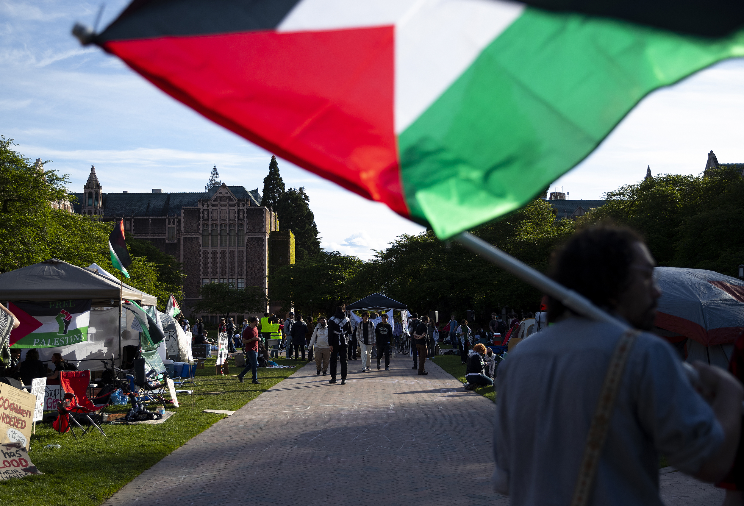 caption: In this file photo, the University of Washington encampment for Palestine grows on the third day, Wednesday, May 1, 2024, on the campus Quad in Seattle. 