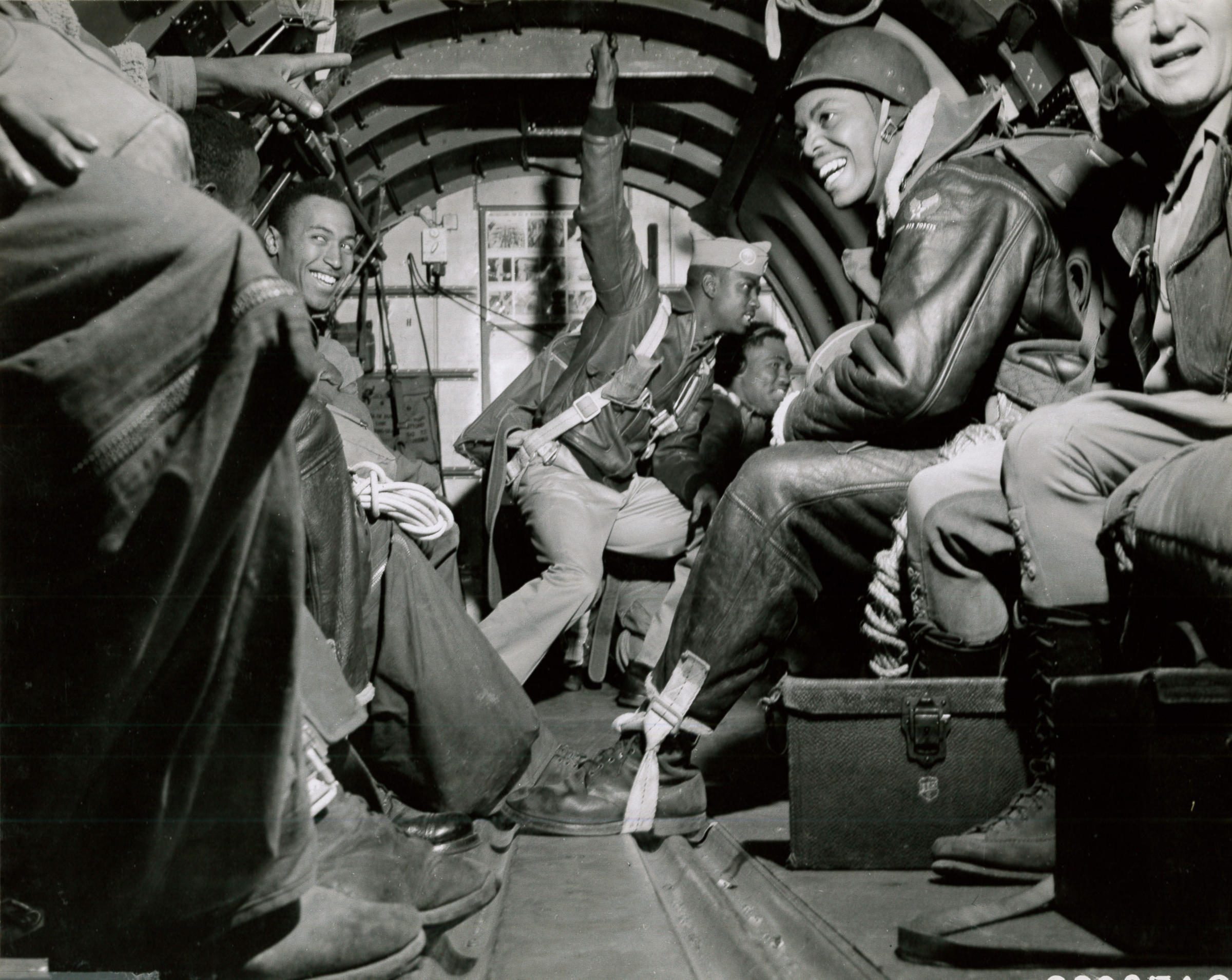 caption: Pendleton-based Army paratroopers get ready to jump over a forest fire in summer 1945.
