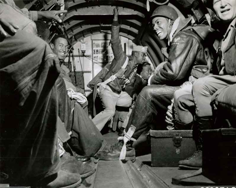caption: Pendleton-based Army paratroopers get ready to jump over a forest fire in summer 1945.
