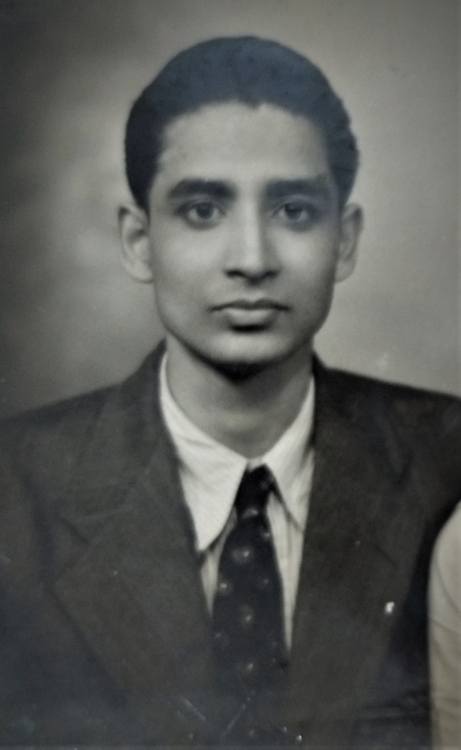 caption: The oldest photograph of the author's grandfather, or thatha in Tamil, taken on his wedding day, about seven years after India’s independence in 1947.