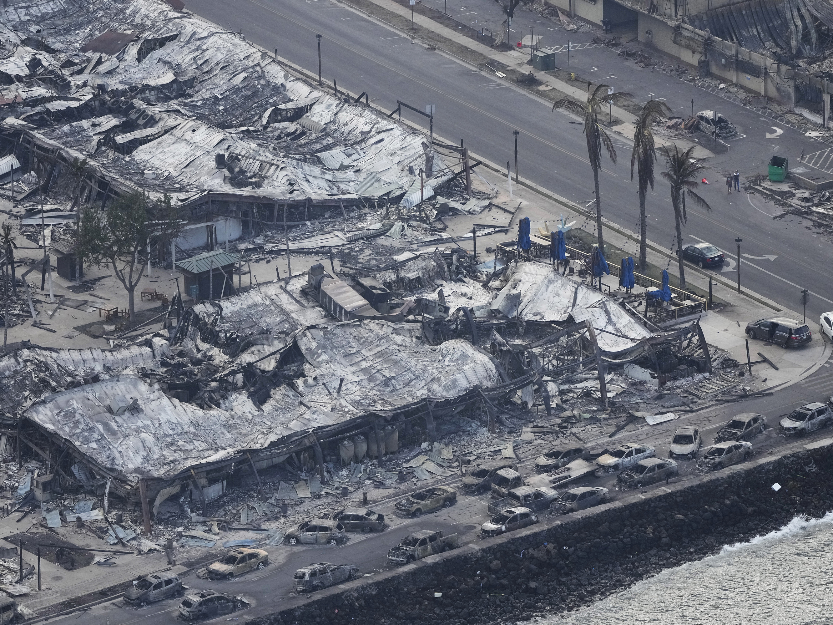 caption: Wildfire wreckage is apparent on Thursday in Lahaina, Hawaii.