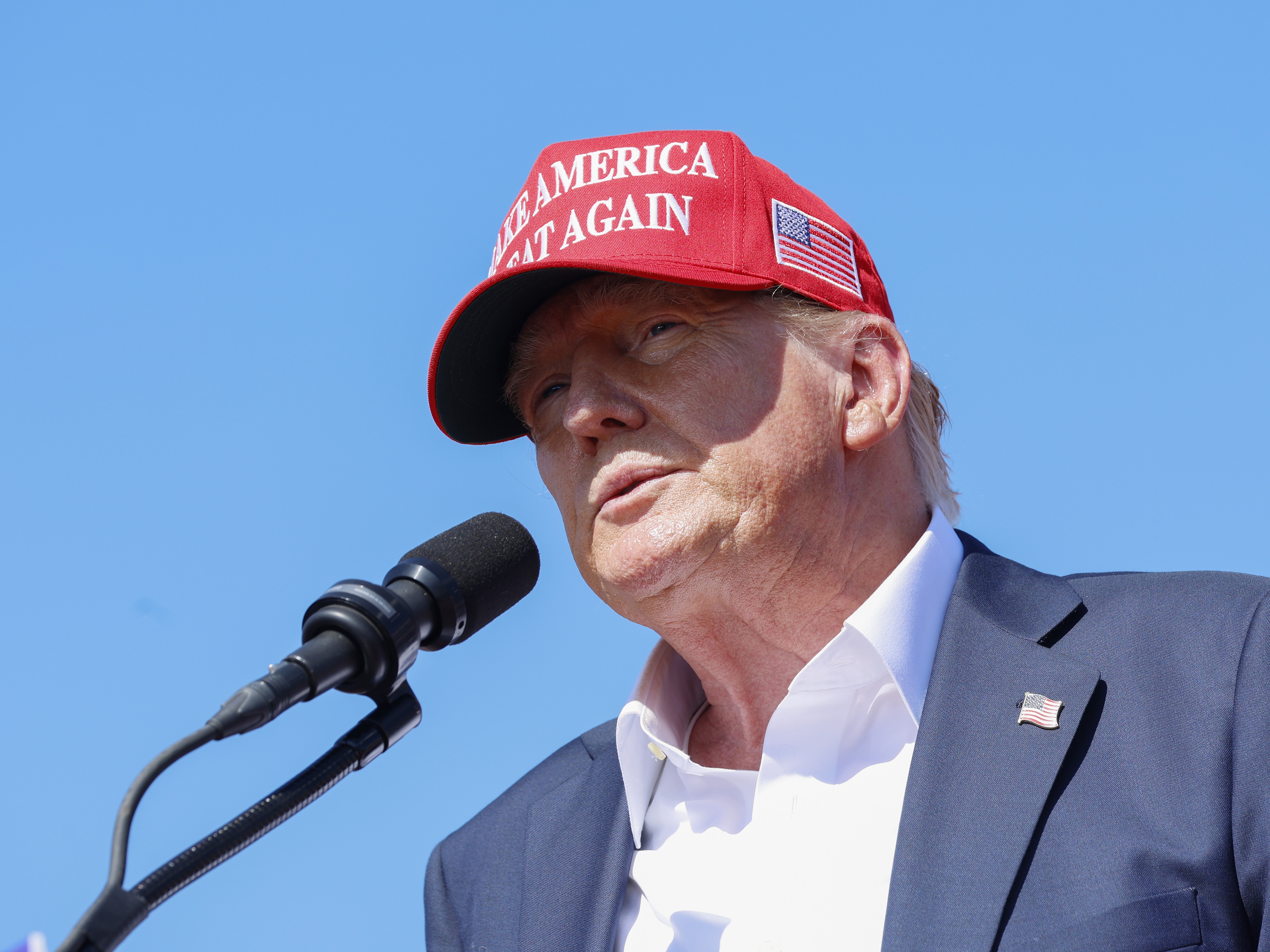 caption: Former U.S. President Donald Trump speaks during a rally at Greenbrier Farms on June 28 in Chesapeake, Va. The judge in the classified documents case against him has paused some deadlines.