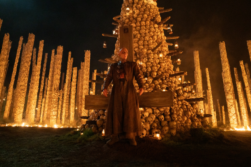 caption: Ralph Fiennes stars as Dr. Kelson in "28 Years Later: The Bone Temple." 