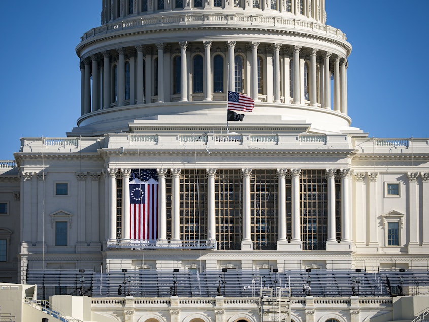caption: The American flag flies at half-staff on the west front of the U.S. Capitol on Saturday. On Monday, House Democrats introduced an impeachment resolution against President Trump over his role in last week's insurrection.