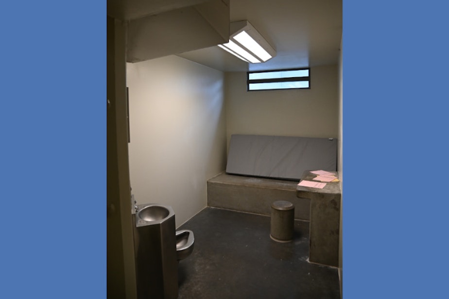 caption: A solitary confinement cell at Monroe Correctional Complex.