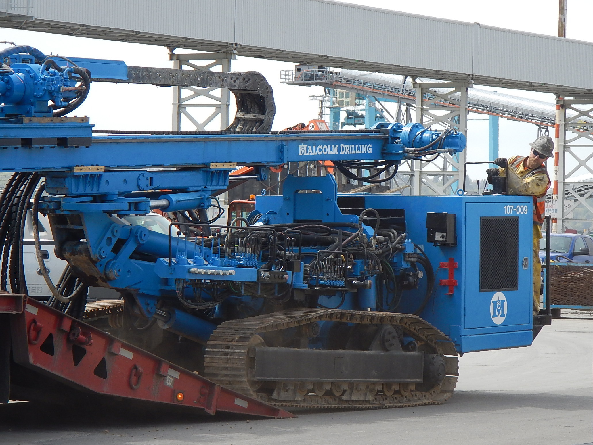 caption: Drilling crews started on Friday and plan to continue around the clock for a month, injecting a cement-water mix into the ground where a shaft will be dug to expose the front of the stalled tunnel machine.
