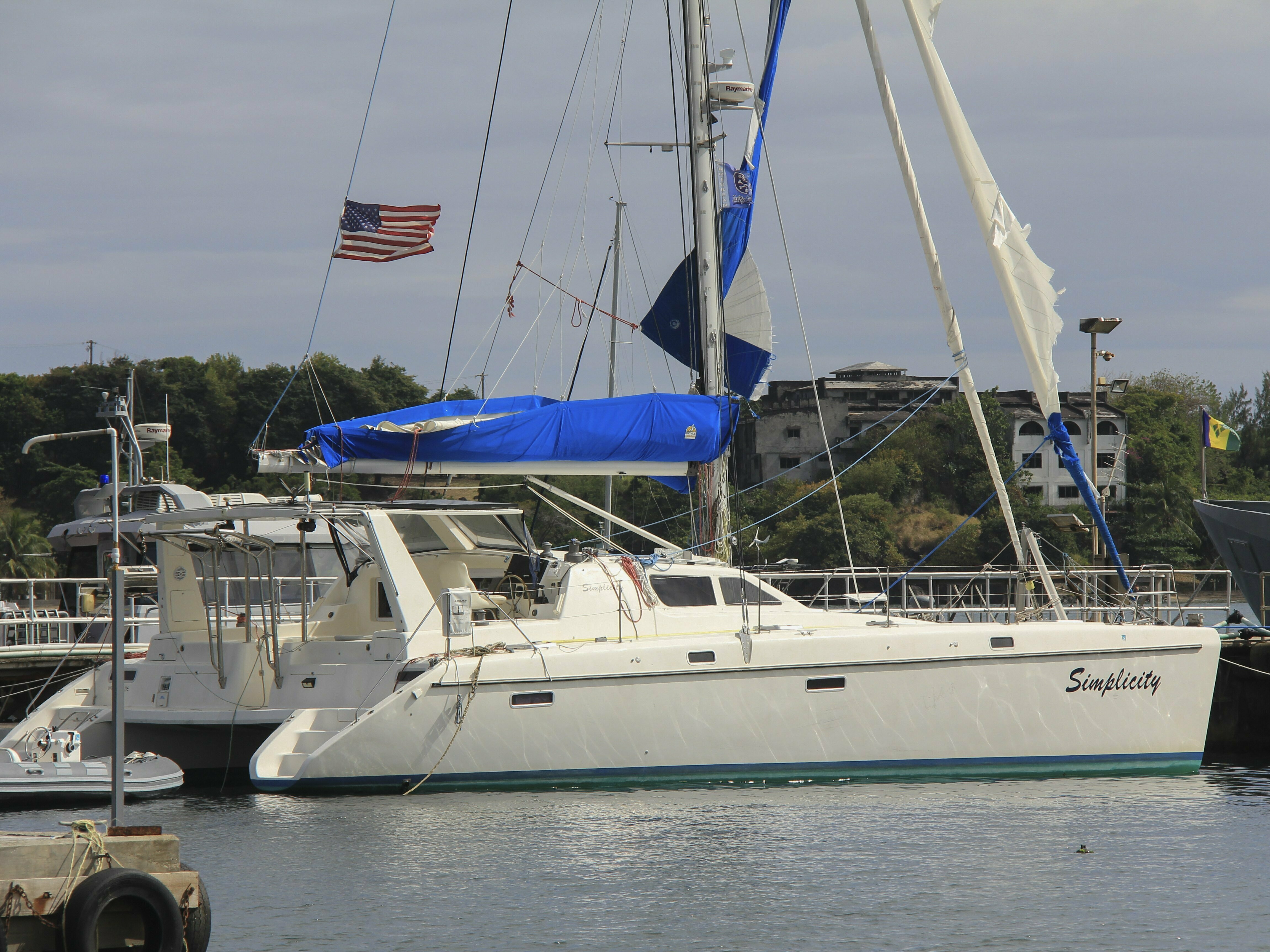 caption: The yacht "Simplicity", that officials say was hijacked by three escaped prisoners with two people aboard, is docked at the St. Vincent and the Grenadines Coastguard Service Calliaqua Base, in Calliaqua, St. Vincent, on Friday.