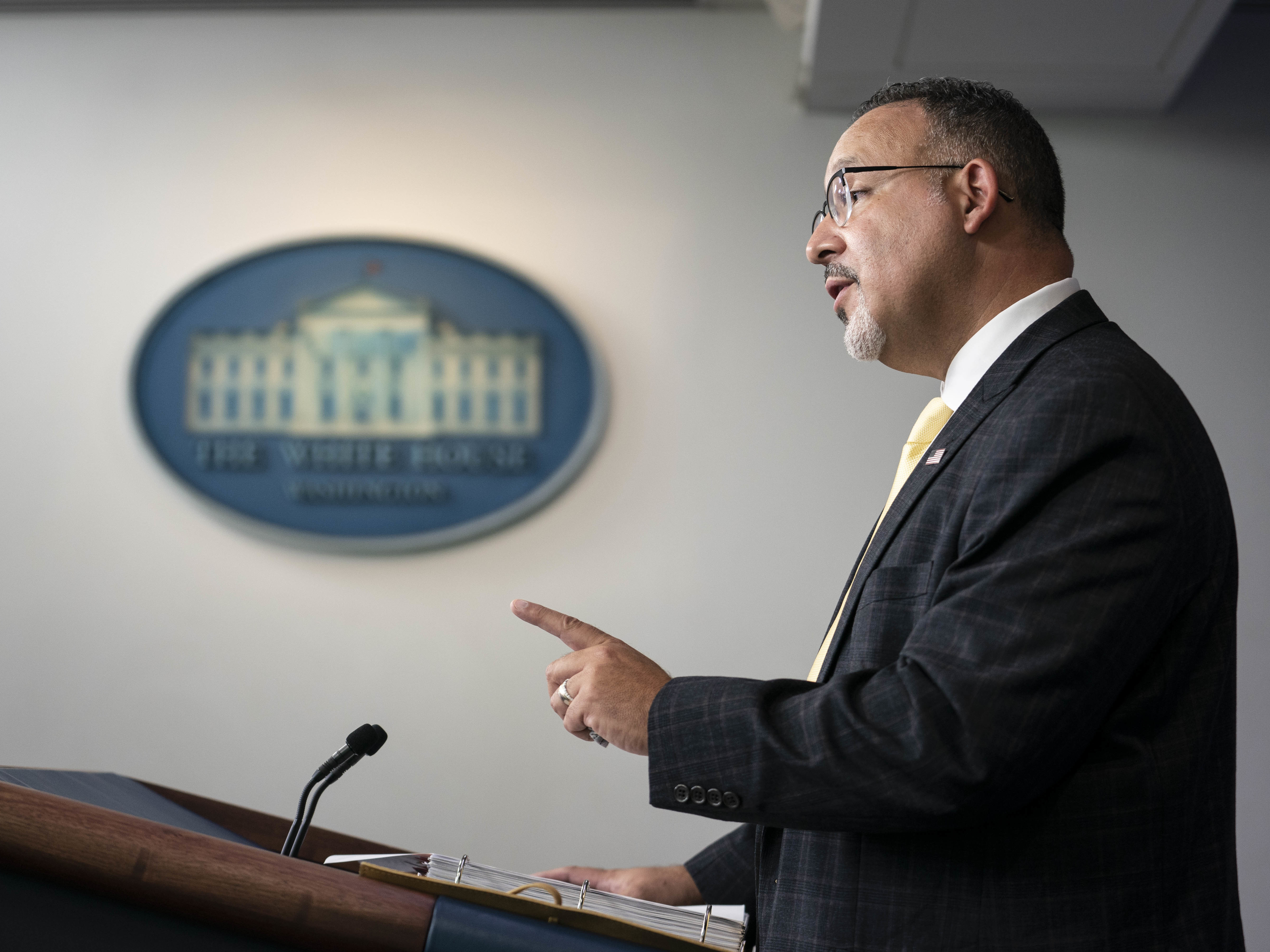 caption: Miguel Cardona, U.S. secretary of education, speaking at a White House press briefing.
