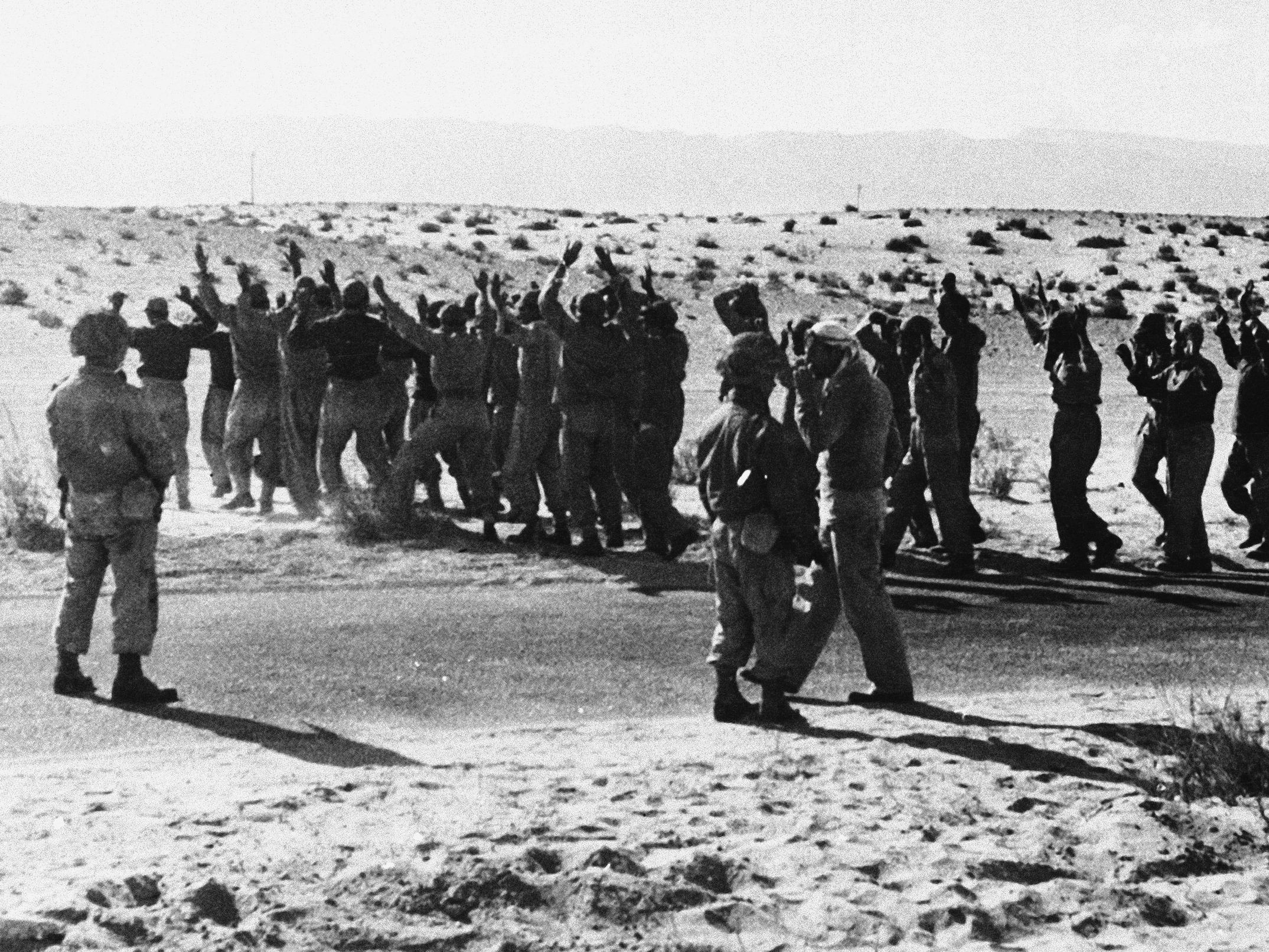 caption: Israeli troops round up Egyptian soldiers captured during fighting in 1956 in the Rafah area of the Gaza Strip, which was controlled by Egypt at the time. Israel, Britain and France invaded Egyptian territory after Egypt moved to nationalize the Suez Canal. But U.S. President Dwight Eisenhower intervened, leading to the withdrawal of foreign troops, including the Israeli forces in Gaza.