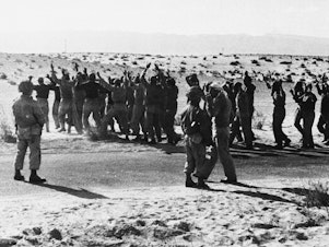 caption: Israeli troops round up Egyptian soldiers captured during fighting in 1956 in the Rafah area of the Gaza Strip, which was controlled by Egypt at the time. Israel, Britain and France invaded Egyptian territory after Egypt moved to nationalize the Suez Canal. But U.S. President Dwight Eisenhower intervened, leading to the withdrawal of foreign troops, including the Israeli forces in Gaza.
