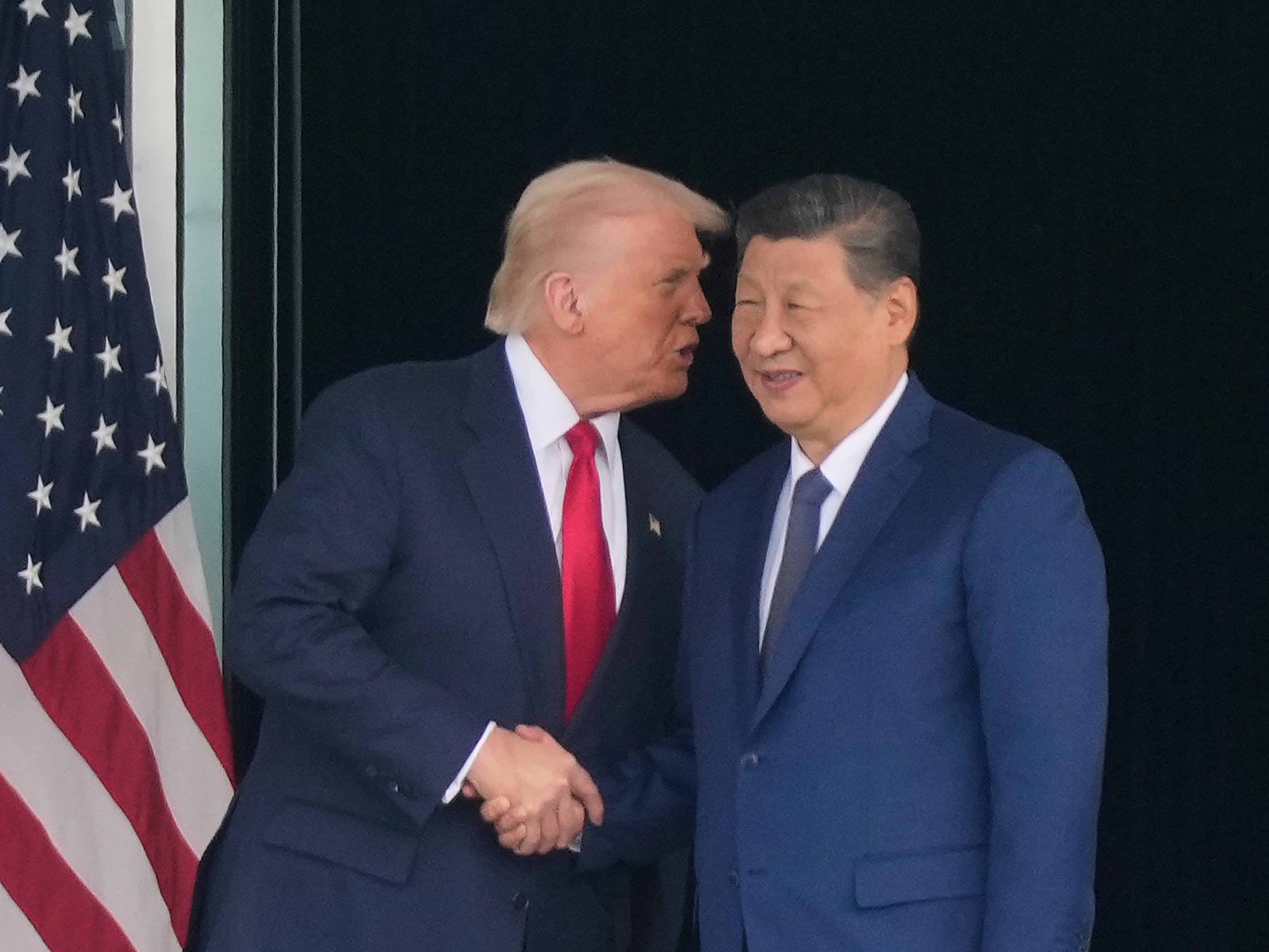 caption: President Donald Trump, left, and Chinese President Xi Jinping, right, shake hands after their U.S.-China summit meeting at Gimhae International Airport Jinping in Busan, South Korea, Thursday, Oct. 30, 2025.