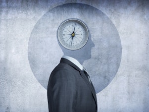 A compass occupies the space over the man's head, conveying the concept of morality and the choices we make.