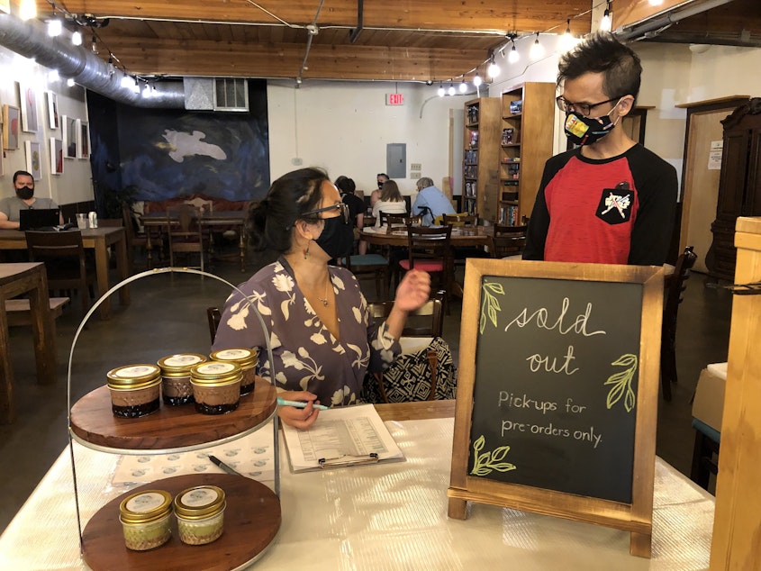 caption: Irene Gurango of Earthbound Family Kitchen is one of the rotating vendors featured at Distant World Coffeehouse. This is Earthbound's first popup. 