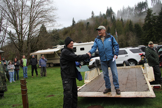 caption: Commissioner of Public Lands Peter Goldmark thanks one of the volunteers at the Great Gravel Pack-In at the Capitol State Forest, March 29, 2014.